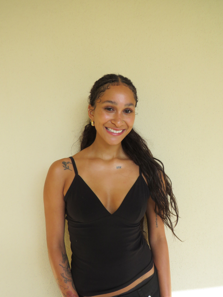 Digital — smiling waist-up shot